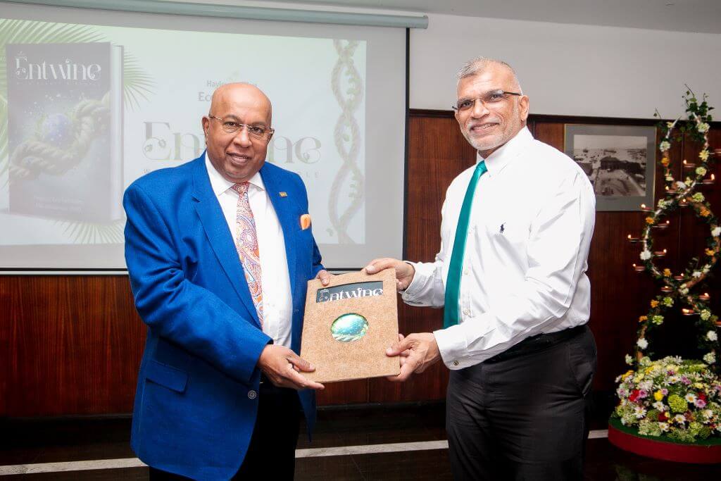 Eco Solutions Managing Director, Rajeeve Goonetileke presenting a copy of Entwine to Hayleys Group Chairman and Chief Executive, Mohan Pandithage